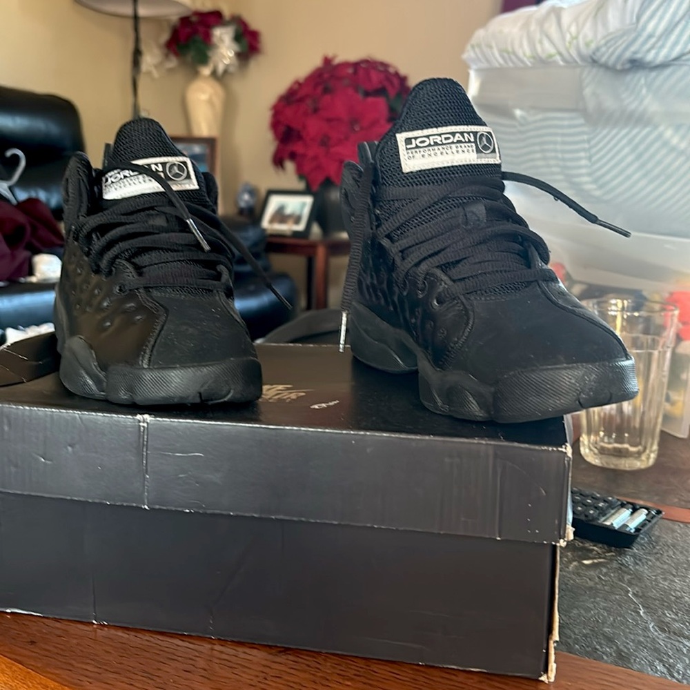 Jordan 13 youth size 4. All black barely worn.